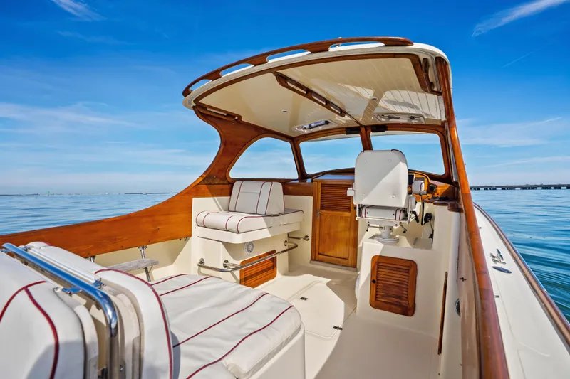 Slide: The Image of 1996 Hinckley 36 Picnic Boat Classic interior with elegant wood finish and ocean view. - 11