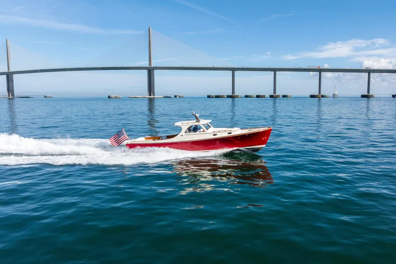 Slide: The Image of Hinckley 36 Picnic Boat Classic cruising under a bridge on a sunny day, 1996 model. - 5