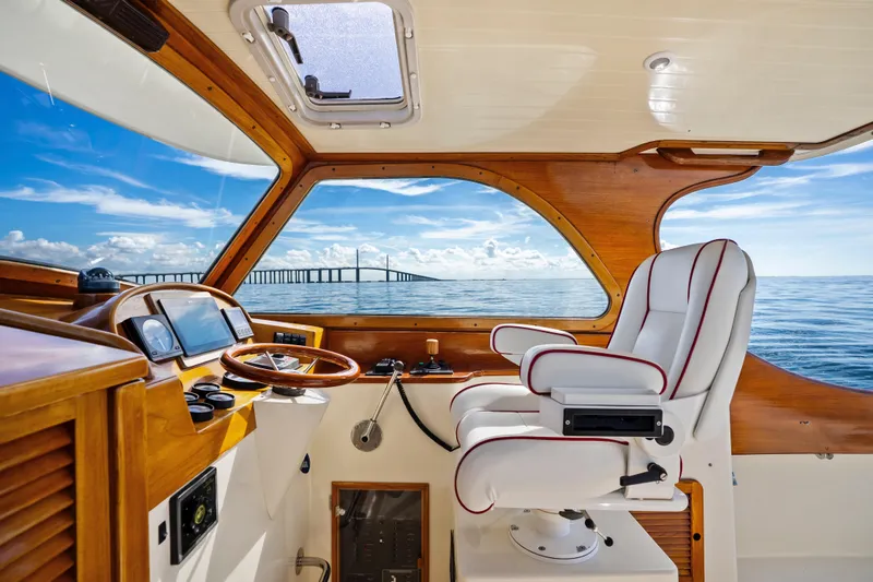 Slide: The Image of Interior of 1996 Hinckley 36 Picnic Boat Classic with ocean view and bridge in background. - 16