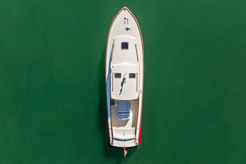 Slide: The Image of Overhead view of 1996 Hinckley 36 Picnic Boat Classic on calm green water. - 3