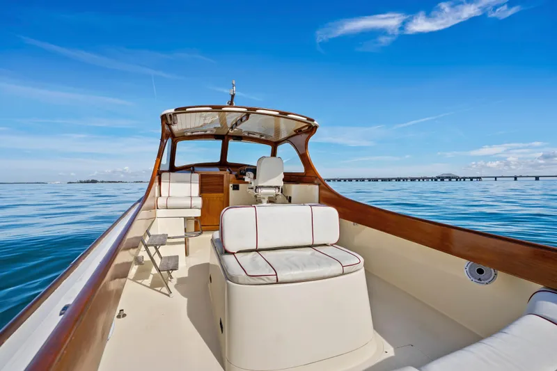 Slide: The Image of 1996 Hinckley 36 Picnic Boat Classic on calm blue waters under clear sky. - 9