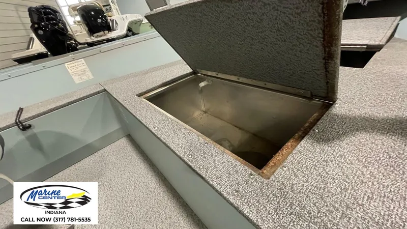 Slide: The Image of Open storage compartment on 2023 Starcraft ANGLER PATRIOT 16 TL boat. - 4
