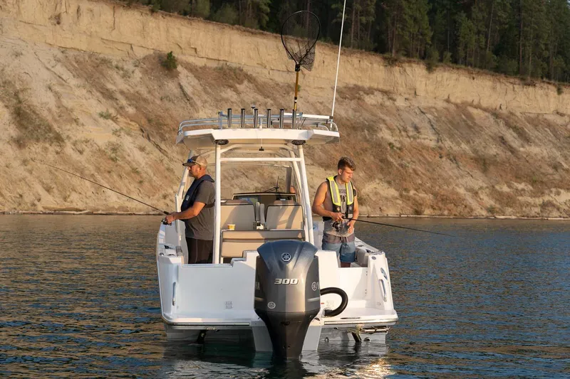 Slide: The Image of 2023 Solara S-250 CW boat with two people fishing on a lake. - 27