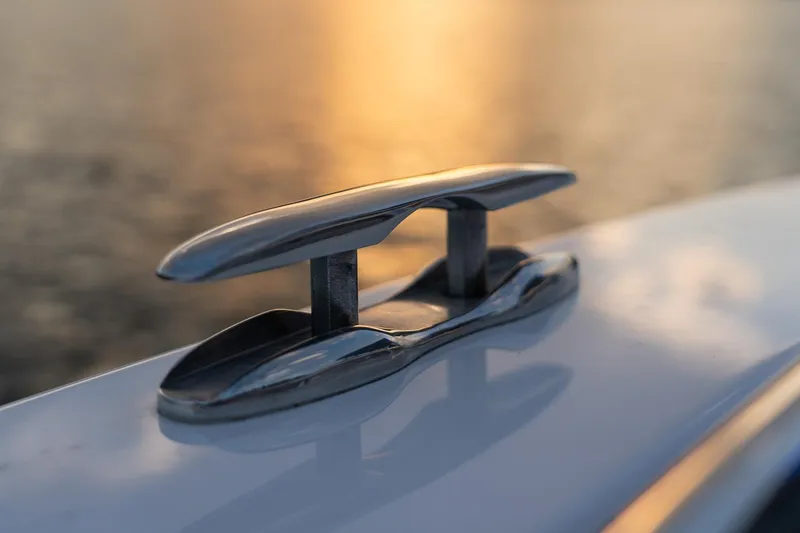 Slide: The Image of Close-up of a cleat on a 2023 Solara S-250 CW boat at sunset. - 33