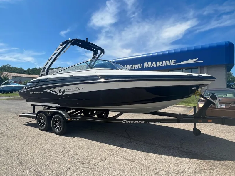 The Image of 2023 Crownline 240 SS SURF boat on trailer at dealership. - 0