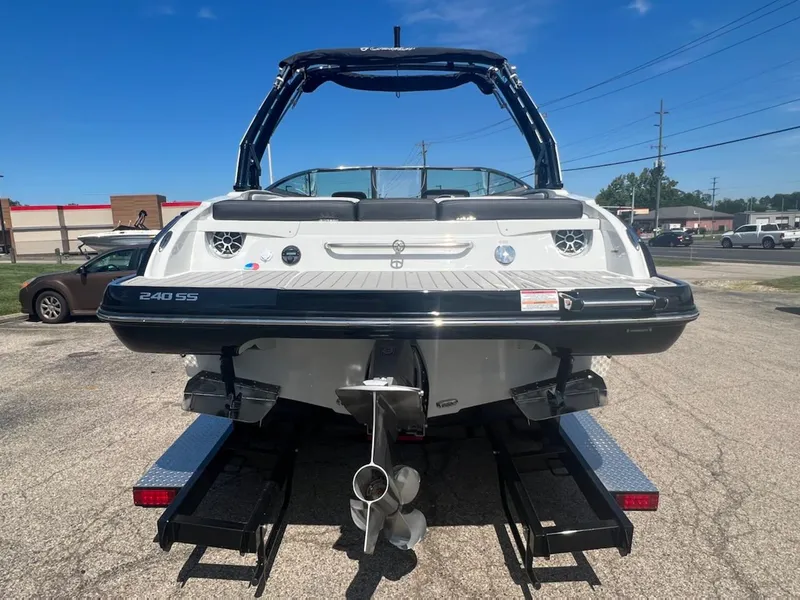 Slide: The Image of 2023 Crownline 240 SS SURF boat on a trailer, rear view. - 9
