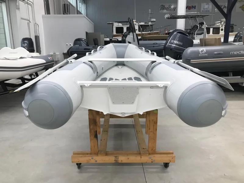 Slide: The Image of 2023 Zodiac Cadet 300 RIB ALU PVC boat in showroom, rear view. - 4