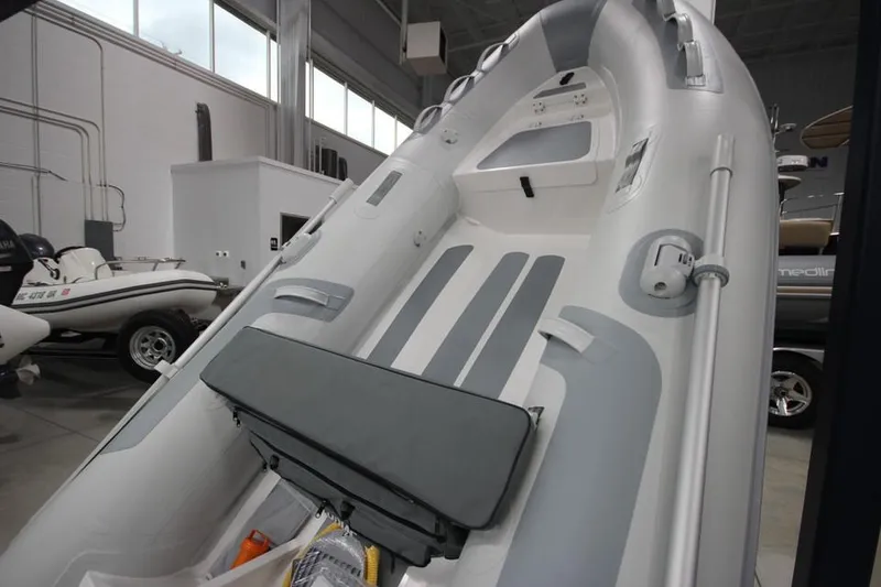 Slide: The Image of 2023 Zodiac Cadet 330 DL RIB ALU PVC boat in showroom. - 1