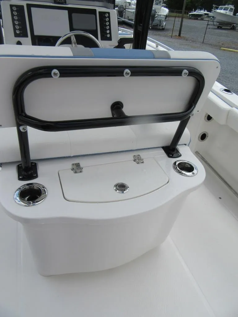 Slide: The Image of 2023 Robalo R222 Center Console boat interior with seating and storage. - 17