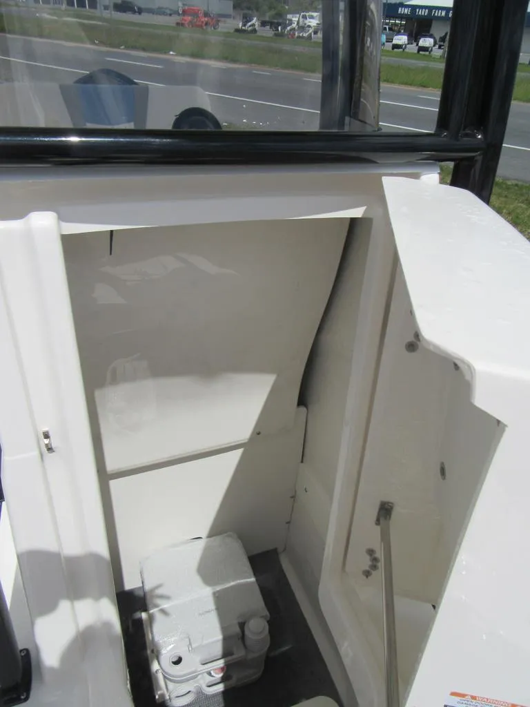 Slide: The Image of 2023 Robalo R222 Center Console storage compartment. - 8