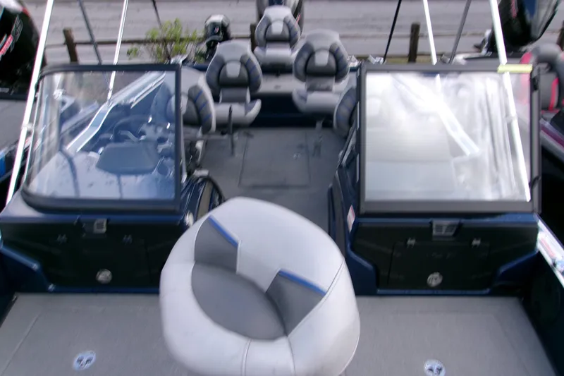 Slide: The Image of 2023 Nitro ZV20 Pro boat interior with seating and windshield, showcasing modern design. - 10