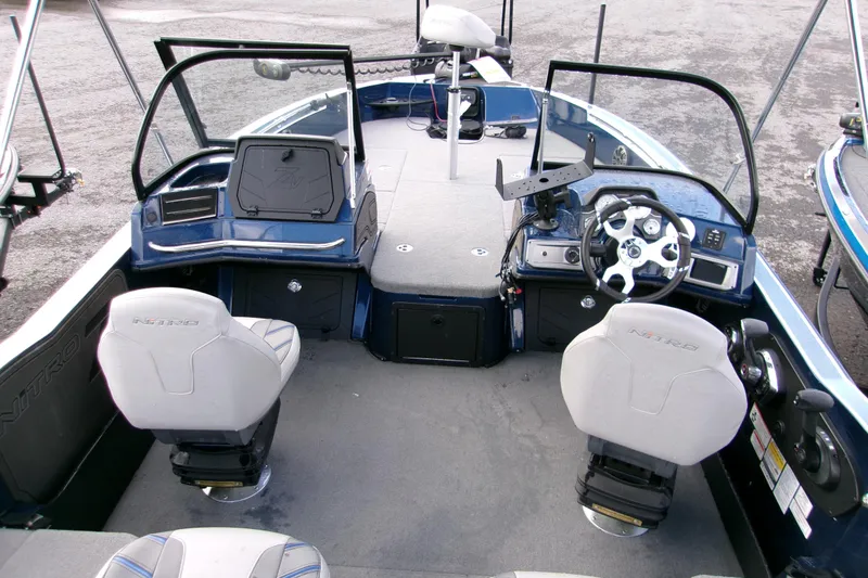 Slide: The Image of 2023 Nitro ZV20 Pro boat interior with dual seats and modern dashboard. - 9
