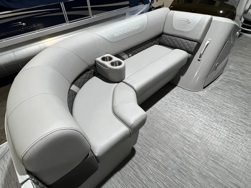 Slide: The Image of 2023 Bennington 22SXSB boat interior with gray seating and cup holders. - 8
