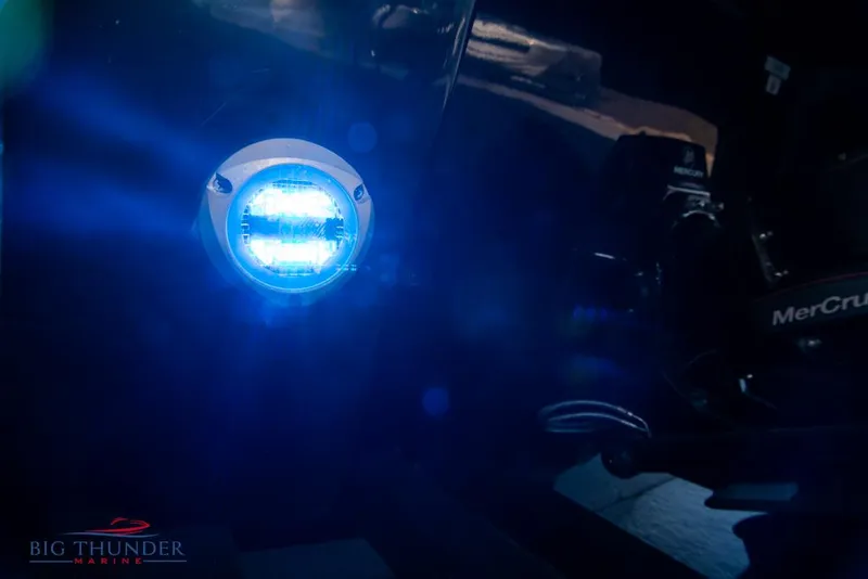 Slide: The Image of Close-up of 2023 Monterey M6 boat with blue LED light and MerCruiser engine. - 11