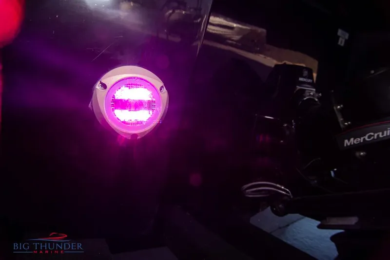 Slide: The Image of 2023 Monterey M6 boat with purple underwater LED light and MerCruiser engine. - 12