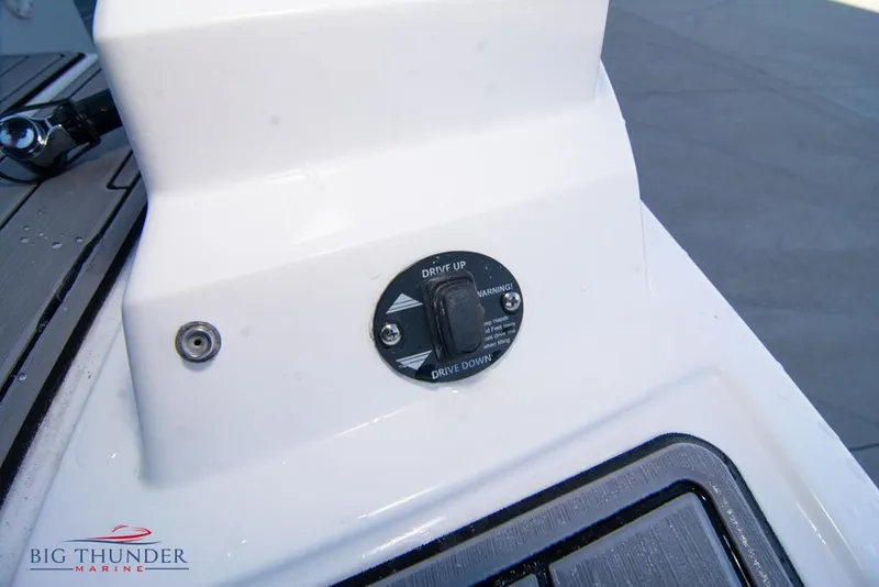 Slide: The Image of 2023 Monterey M6 boat drive control switch on white panel. - 20