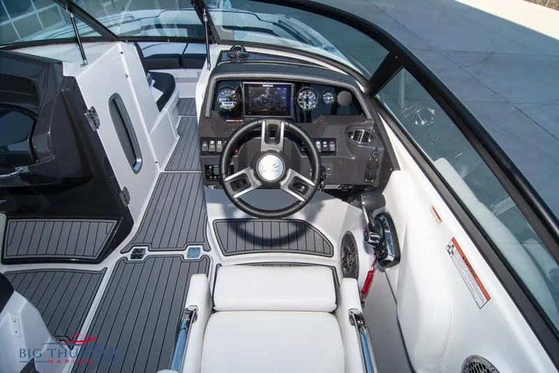 Slide: The Image of 2023 Monterey M6 boat cockpit with modern dashboard and steering wheel. - 33