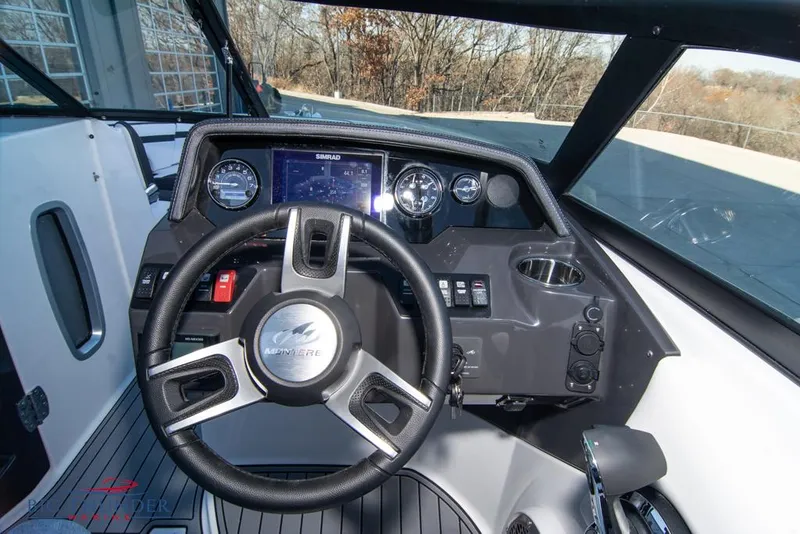 Slide: The Image of 2023 Monterey M6 boat dashboard with steering wheel and control panel. - 35