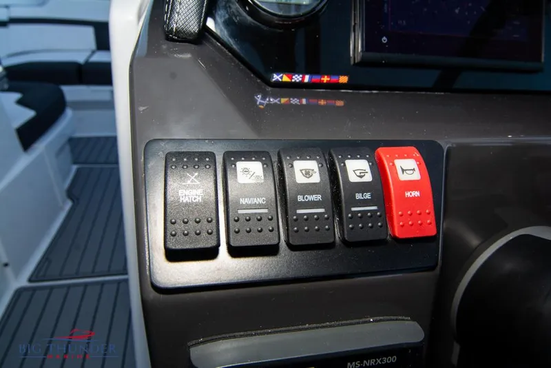 Slide: The Image of Control panel of a 2023 Monterey M6 boat with labeled switches. - 39