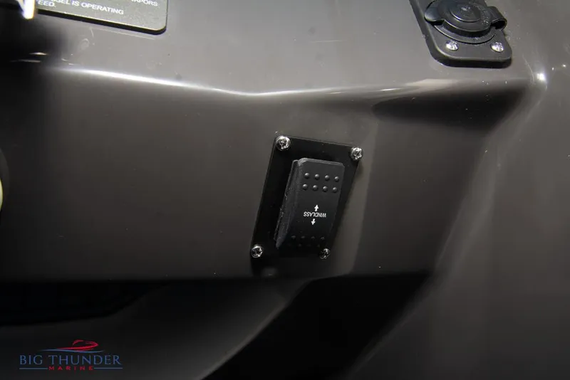 Slide: The Image of 2023 Monterey M6 boat dashboard with control switch and Big Thunder Marine logo. - 42