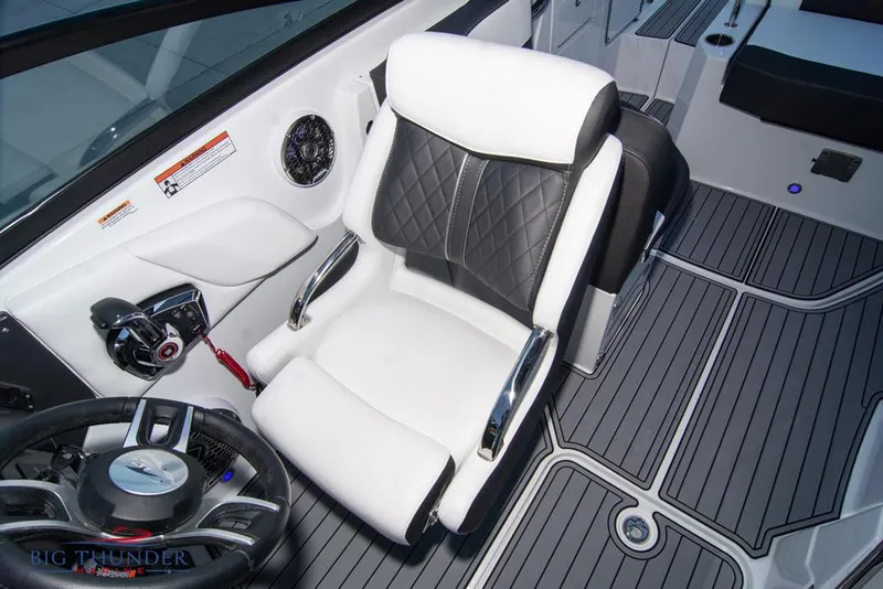 Slide: The Image of 2023 Monterey M6 boat interior with captain's chair and steering wheel. - 45