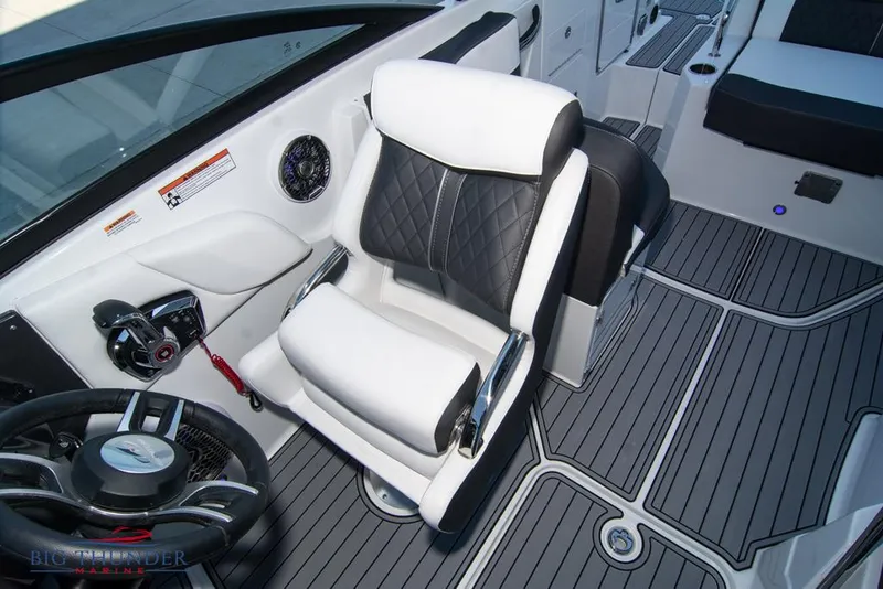 Slide: The Image of 2023 Monterey M6 boat interior with captain's chair and steering wheel. - 46