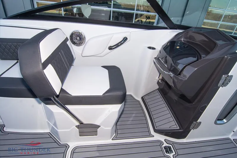 Slide: The Image of 2023 Monterey M6 boat interior with black and white seating and modern dashboard. - 48