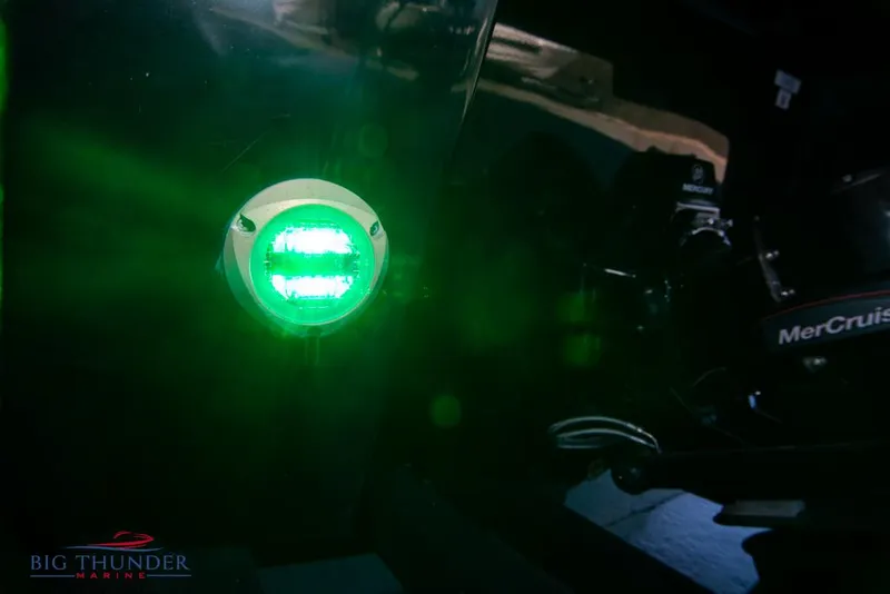 Slide: The Image of 2023 Monterey M6 boat with green navigation light and MerCruiser engine. - 9