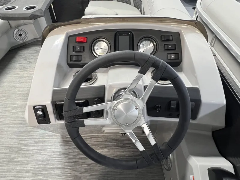 Slide: The Image of Steering wheel and dashboard of 2023 Bennington 22SXSRC boat. - 10