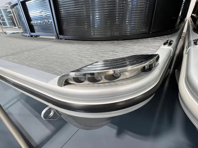 Slide: The Image of 2023 Bennington 22SXSRC pontoon boat, sleek design with modern lighting features. - 6