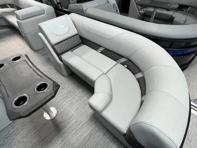 Slide: The Image of 2023 Bennington 22SXSRC boat interior with luxurious gray seating and cupholder table. - 8