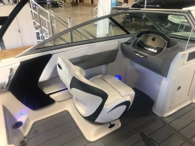 Slide: The Image of 2023 Chaparral 21 Surf boat interior with modern helm and seating. - 10