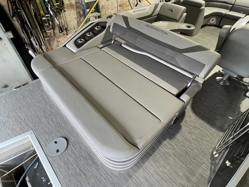 Slide: The Image of 2023 Bennington 22SXSB boat interior with gray seating and cup holders. - 10