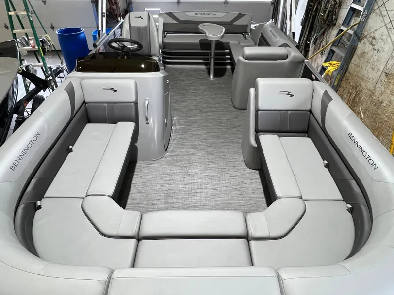 Slide: The Image of 2023 Bennington 22SXSB pontoon boat interior with spacious seating and modern design. - 2