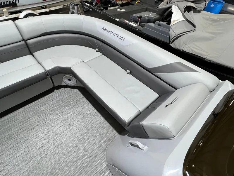 Slide: The Image of 2023 Bennington 22SXSB boat interior with sleek gray seating and modern design. - 3