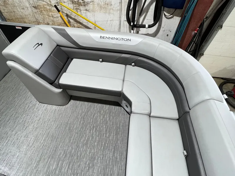 Slide: The Image of 2023 Bennington 22SXSB boat interior with gray seating and modern design. - 5