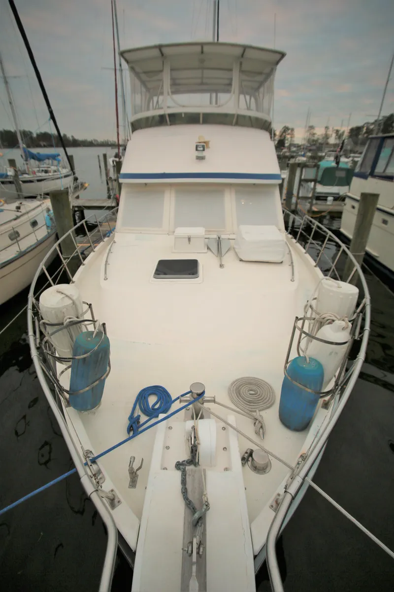 Slide: The Image of 1987 Jefferson 42 Sundeck Motor Yacht docked at marina. - 3