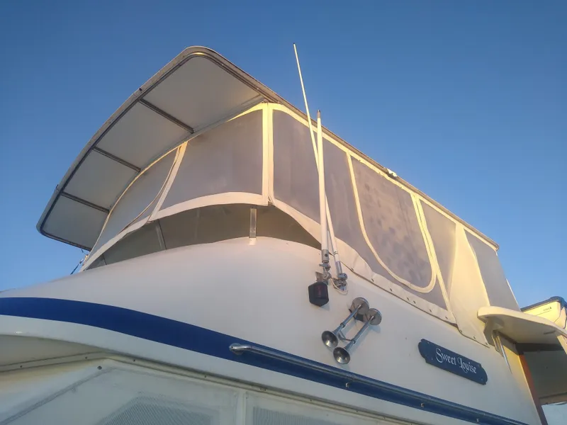 Slide: The Image of 1987 Jefferson 42 Sundeck Motor Yacht exterior view with clear skies. - 10