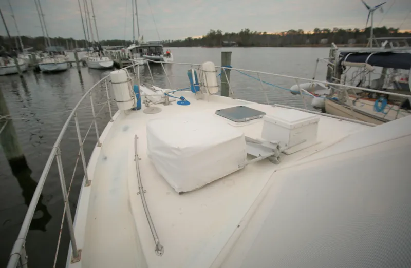 Slide: The Image of 1987 Jefferson 42 Sundeck Motor Yacht docked at a marina. - 2