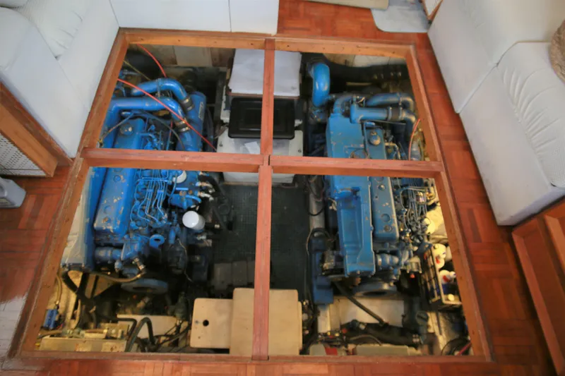 Slide: The Image of Engine room of a 1987 Jefferson 42 Sundeck Motor Yacht with twin blue engines. - 20