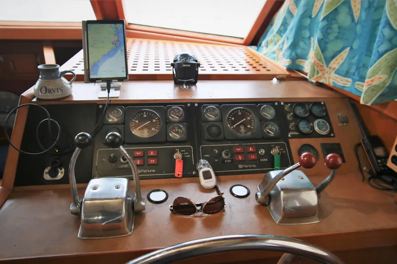 Slide: The Image of Control panel of a 1987 Jefferson 42 Sundeck Motor Yacht with navigation equipment. - 41