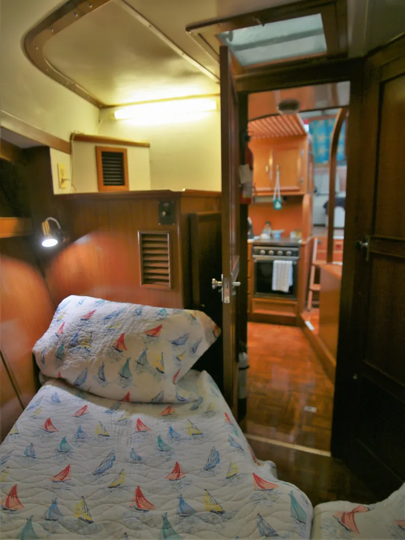 Slide: The Image of Cozy cabin interior of a 1987 Jefferson 42 Sundeck Motor Yacht. - 47