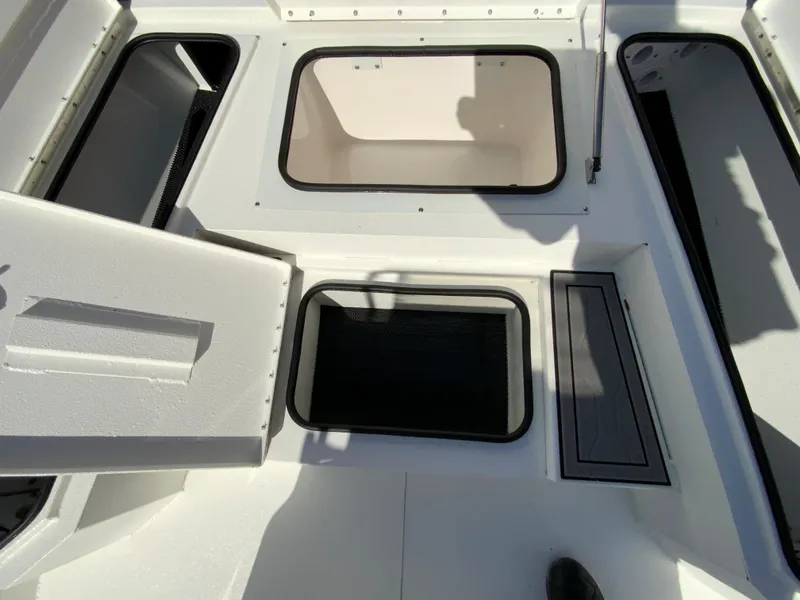 Slide: The Image of 2023 Avid 21 Mag boat storage compartments and hatches. - 11