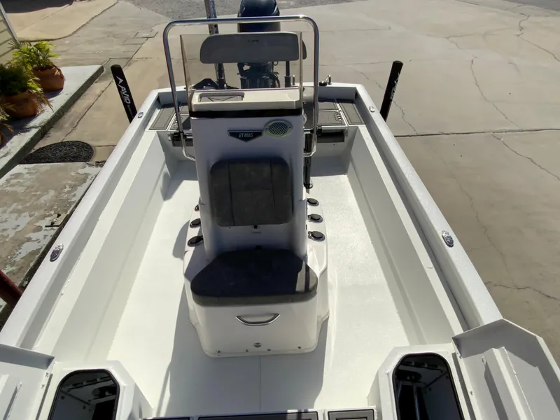 Slide: The Image of 2023 Avid 21 Mag boat interior with center console and seating. - 12