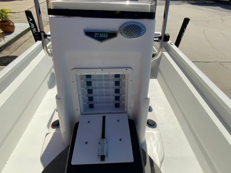 Slide: The Image of 2023 Avid 21 Mag boat interior with storage compartment and seating. - 13
