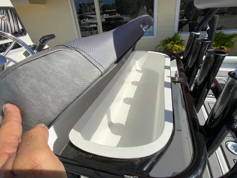 Slide: The Image of 2023 Avid 21 Mag boat with open storage compartment. - 15