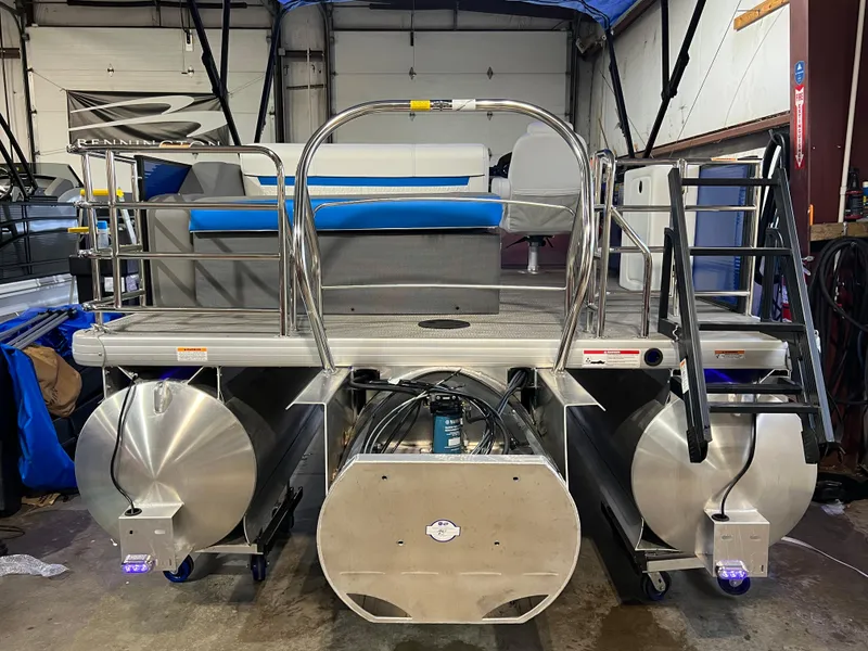 Slide: The Image of 2023 Godfrey SWEETWATER 2286 SFL pontoon boat in a garage setting. - 9