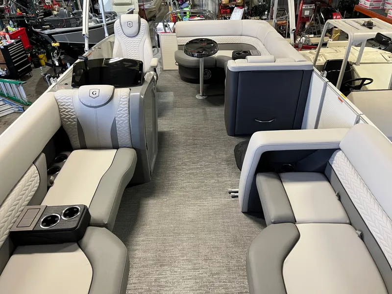 Slide: The Image of 2023 Godfrey Monaco MC215C pontoon boat interior with luxurious seating and modern design. - 4