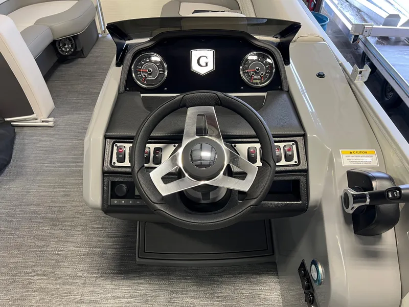 Slide: The Image of 2023 Godfrey Monaco MC215C dashboard with steering wheel and controls. - 8