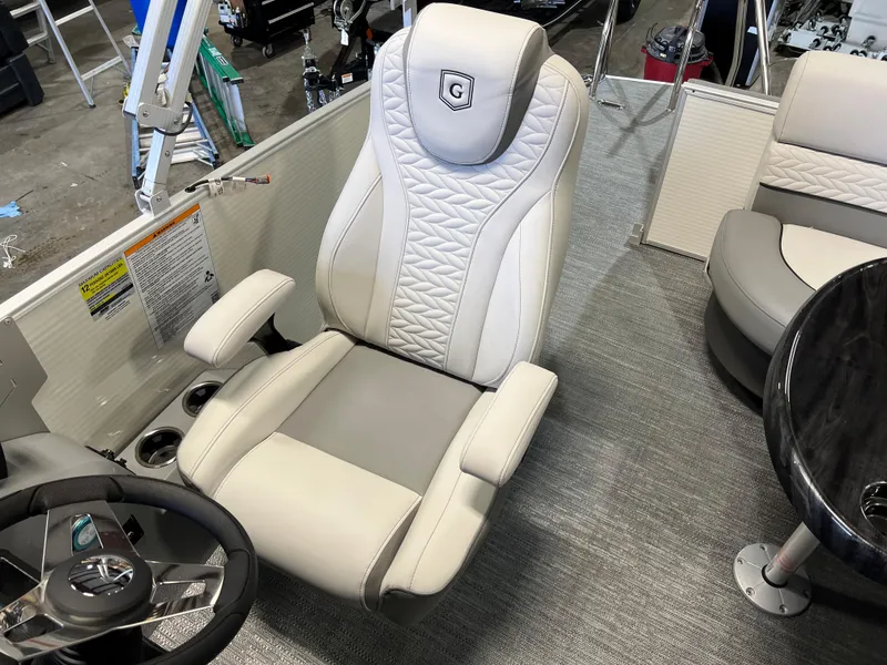 Slide: The Image of Captain's chair in 2023 Godfrey Monaco MC215C boat, featuring luxurious design and comfortable seating. - 9